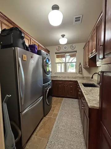 a bed room with a bed and a chair