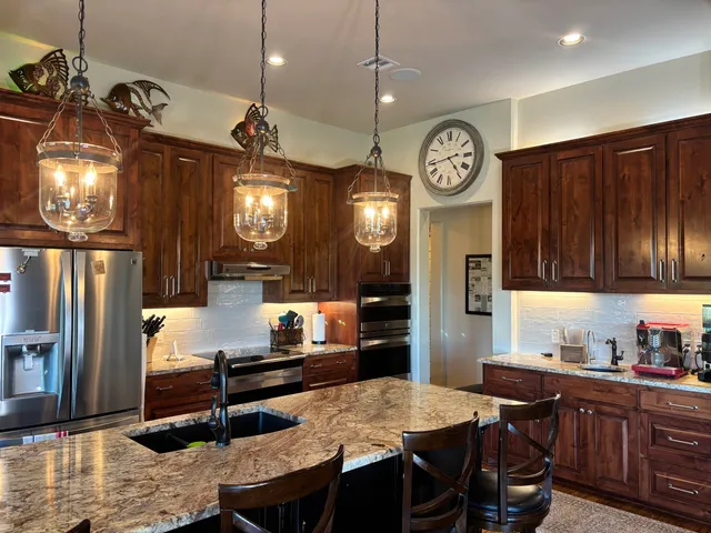 a kitchen with a table and chairs in it