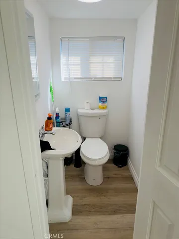 a white toilet sitting next to a bathroom sink
