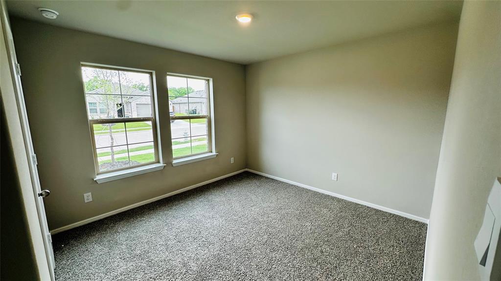 380 Wildrose Circle Cleburne, TX 76033 - Photo 12 of 20 an empty room with a window