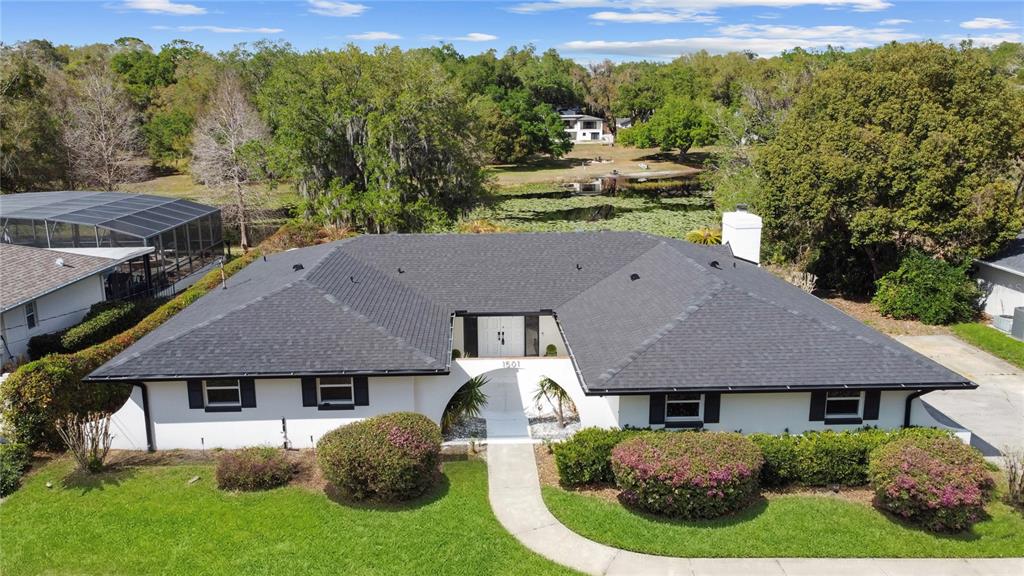 1501 Druid Isle Road Maitland, FL 32751 - Photo 1 of 54 an aerial view of a house with a big yard