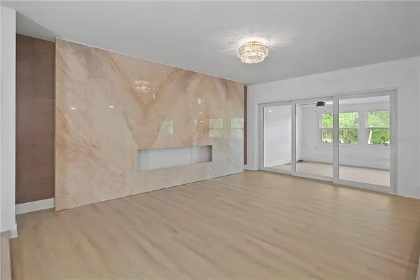 a large bathroom with a large mirror vanity and shower