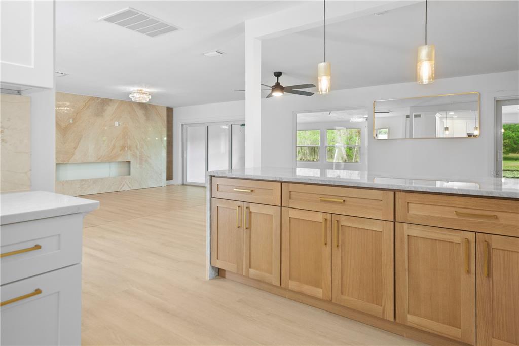 1501 Druid Isle Road Maitland, FL 32751 - Photo 15 of 54 a large bathroom with a large mirror vanity and shower