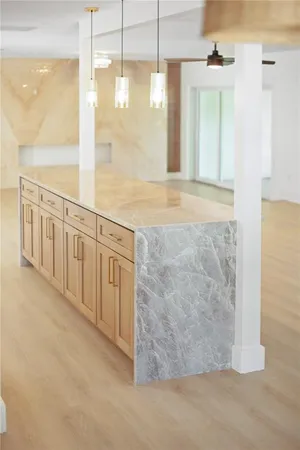 a kitchen with stainless steel appliances a refrigerator stove and microwave