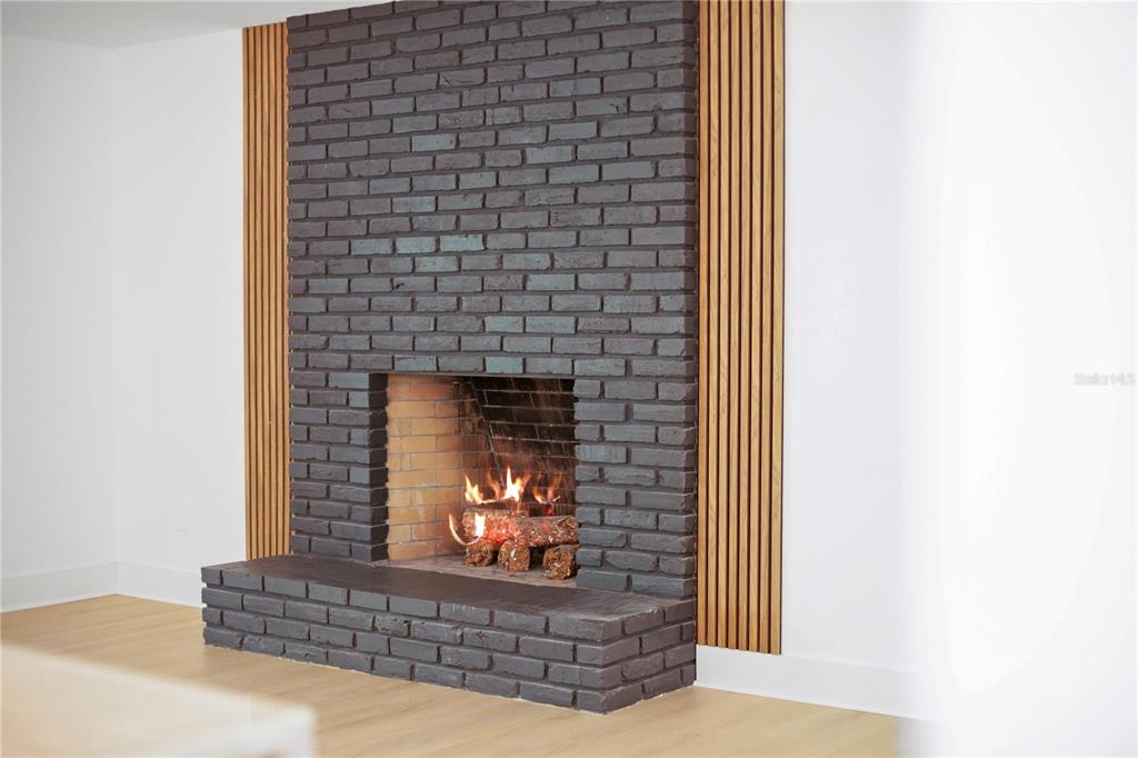 1501 Druid Isle Road Maitland, FL 32751 - Photo 27 of 54 a living room with furniture and a fireplace