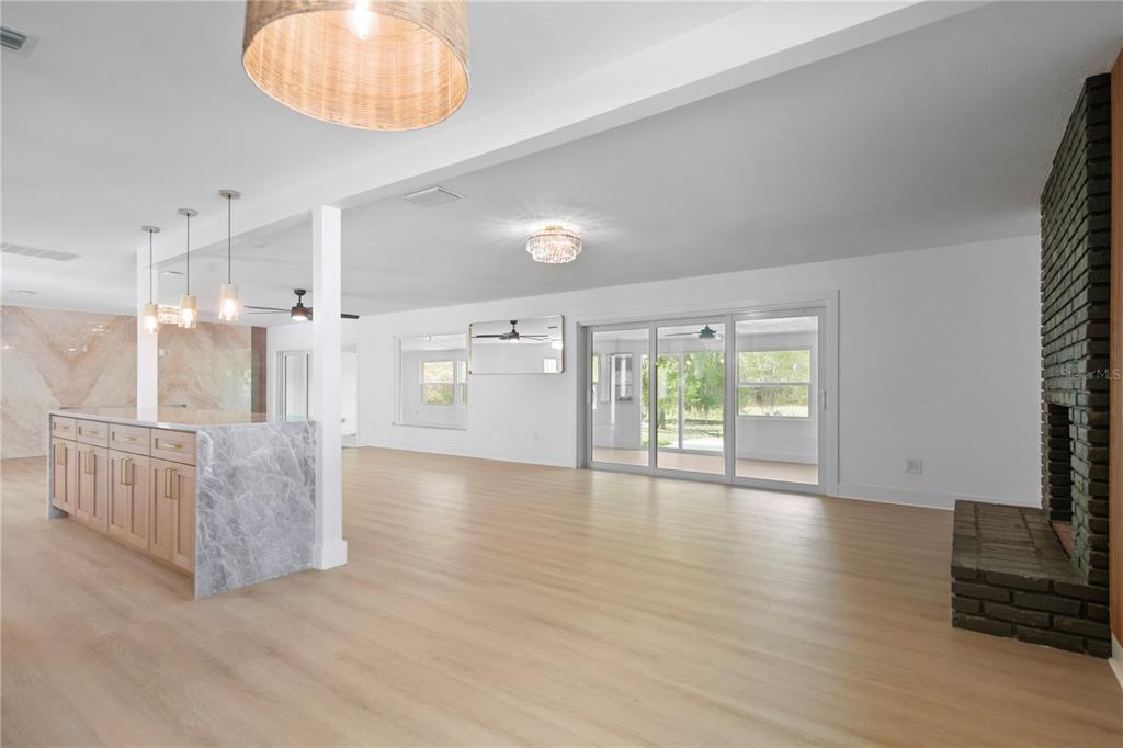 1501 Druid Isle Road Maitland, FL 32751 - Photo 29 of 54 a view of an empty room with a window and wooden floor