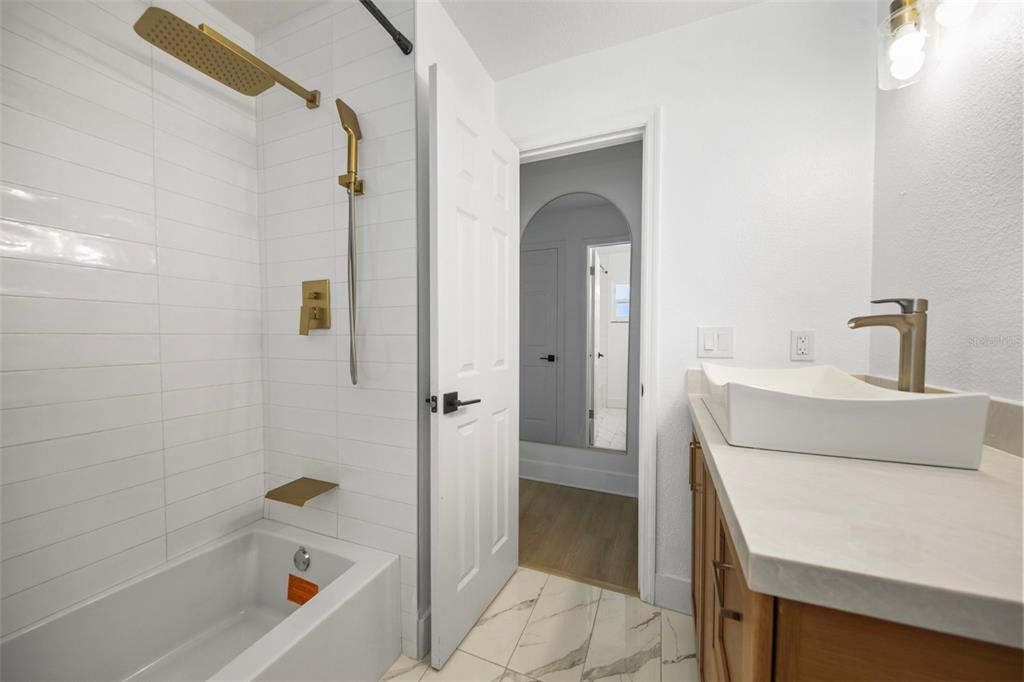 1501 Druid Isle Road Maitland, FL 32751 - Photo 32 of 54 a bathroom with a sink a toilet and shower