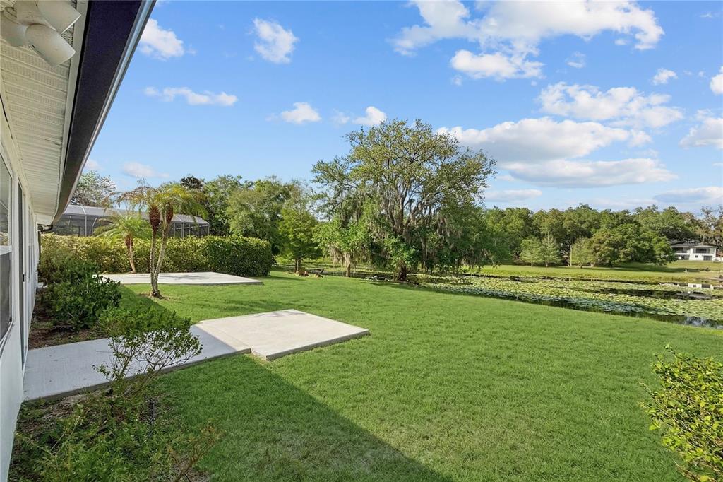 1501 Druid Isle Road Maitland, FL 32751 - Photo 35 of 54 a view of a golf course with a lake