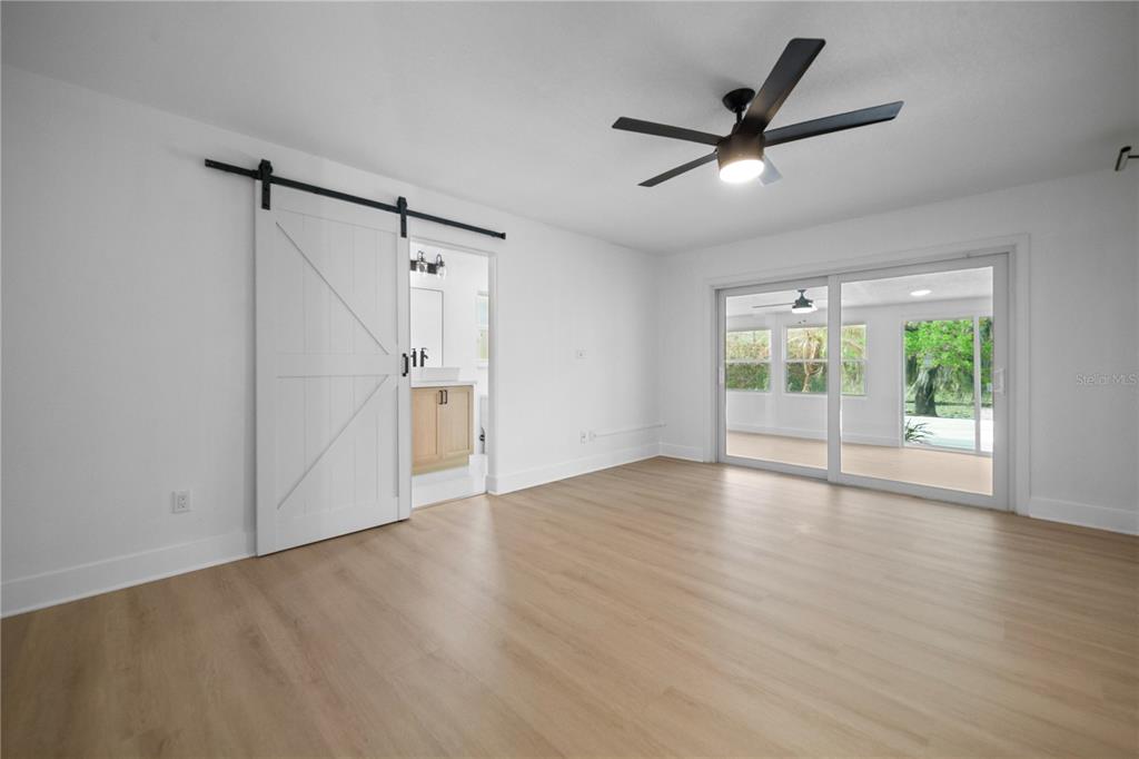1501 Druid Isle Road Maitland, FL 32751 - Photo 36 of 54 a view of an empty room with wooden floor and a window