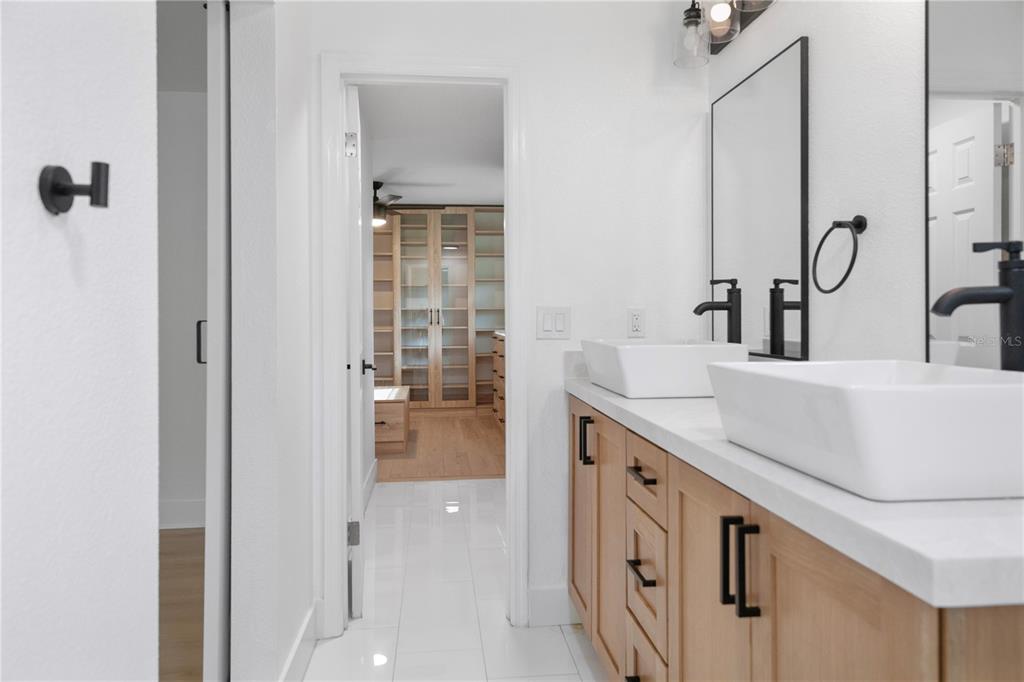 1501 Druid Isle Road Maitland, FL 32751 - Photo 40 of 54 a spacious bathroom with a double vanity sink a mirror and shower