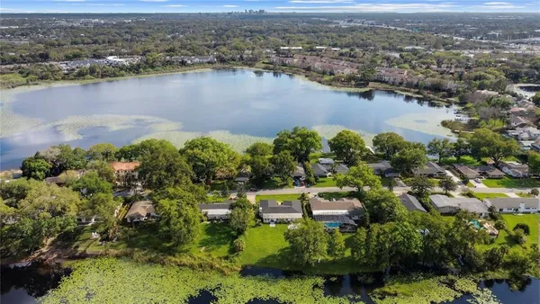 an aerial view of a house with a lake view