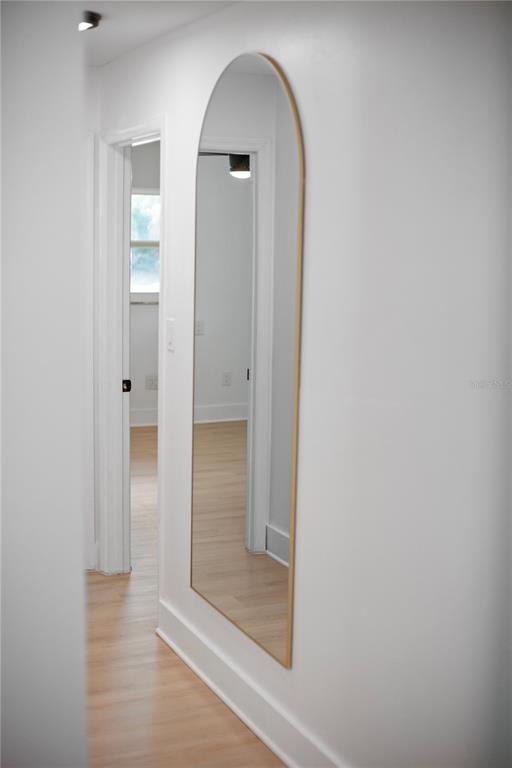 1501 Druid Isle Road Maitland, FL 32751 - Photo 47 of 54 an empty room with mirror in hallway