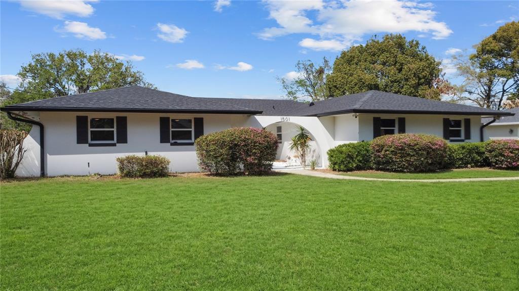 1501 Druid Isle Road Maitland, FL 32751 - Photo 53 of 54 a front view of a house with a garden