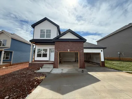 a front view of a house with yard