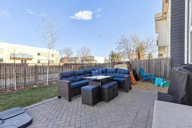 a view of a backyard with sitting area
