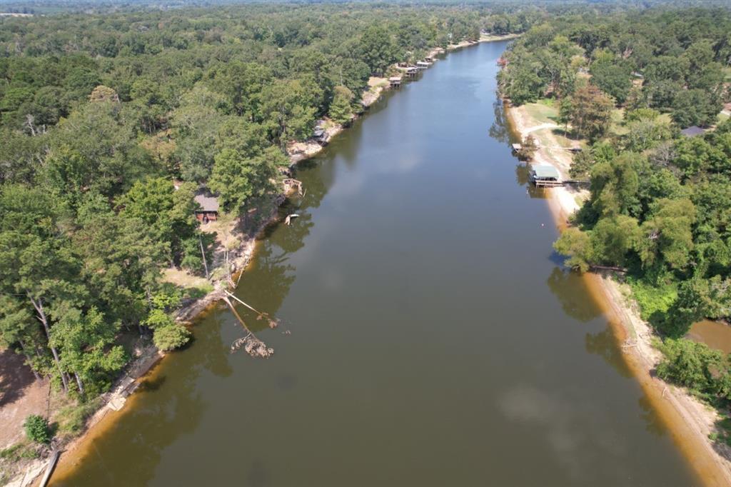 5 County Road 3545 Joaquin, TX 75954 - Photo 13 of 18 an aerial view of a house with a yard and lake view