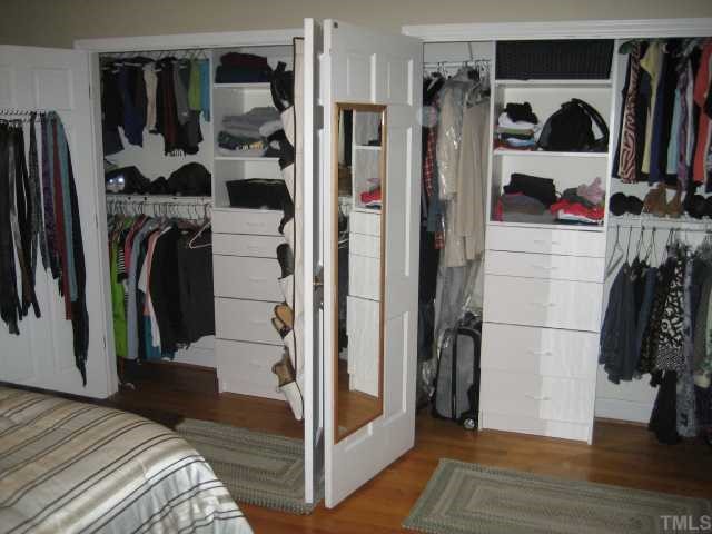1545 Shadowood Lane Raleigh, NC 27612 - Photo 11 of 12 a view of walk in closet with clothes and shoes