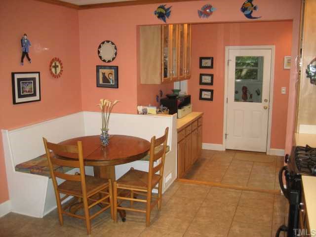 1545 Shadowood Lane Raleigh, NC 27612 - Photo 9 of 12 a dining room with furniture and window