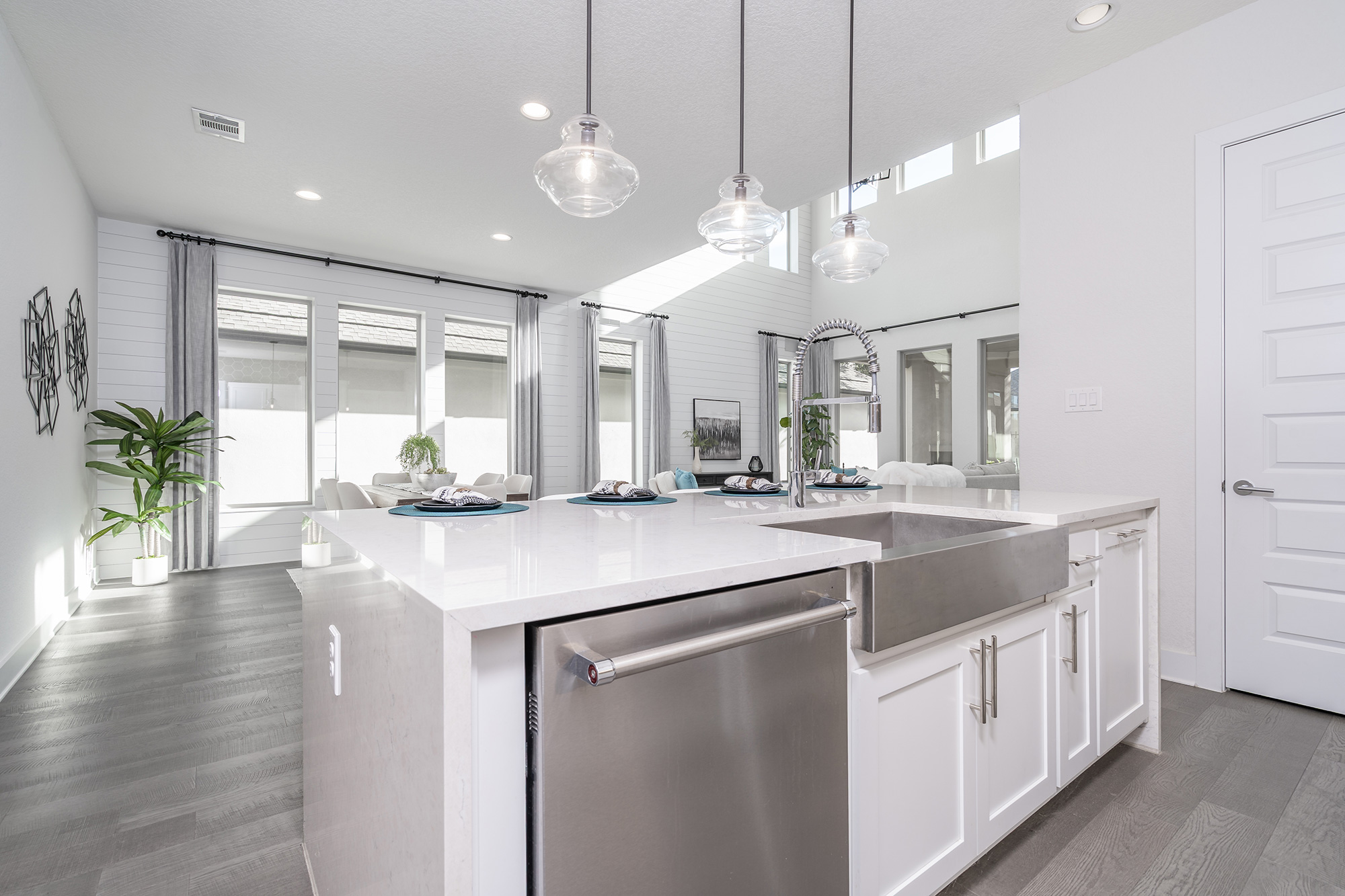 120 Diamondback Drive Georgetown, TX 78628 - Photo 18 of 39 a kitchen with kitchen island white cabinets and chandelier