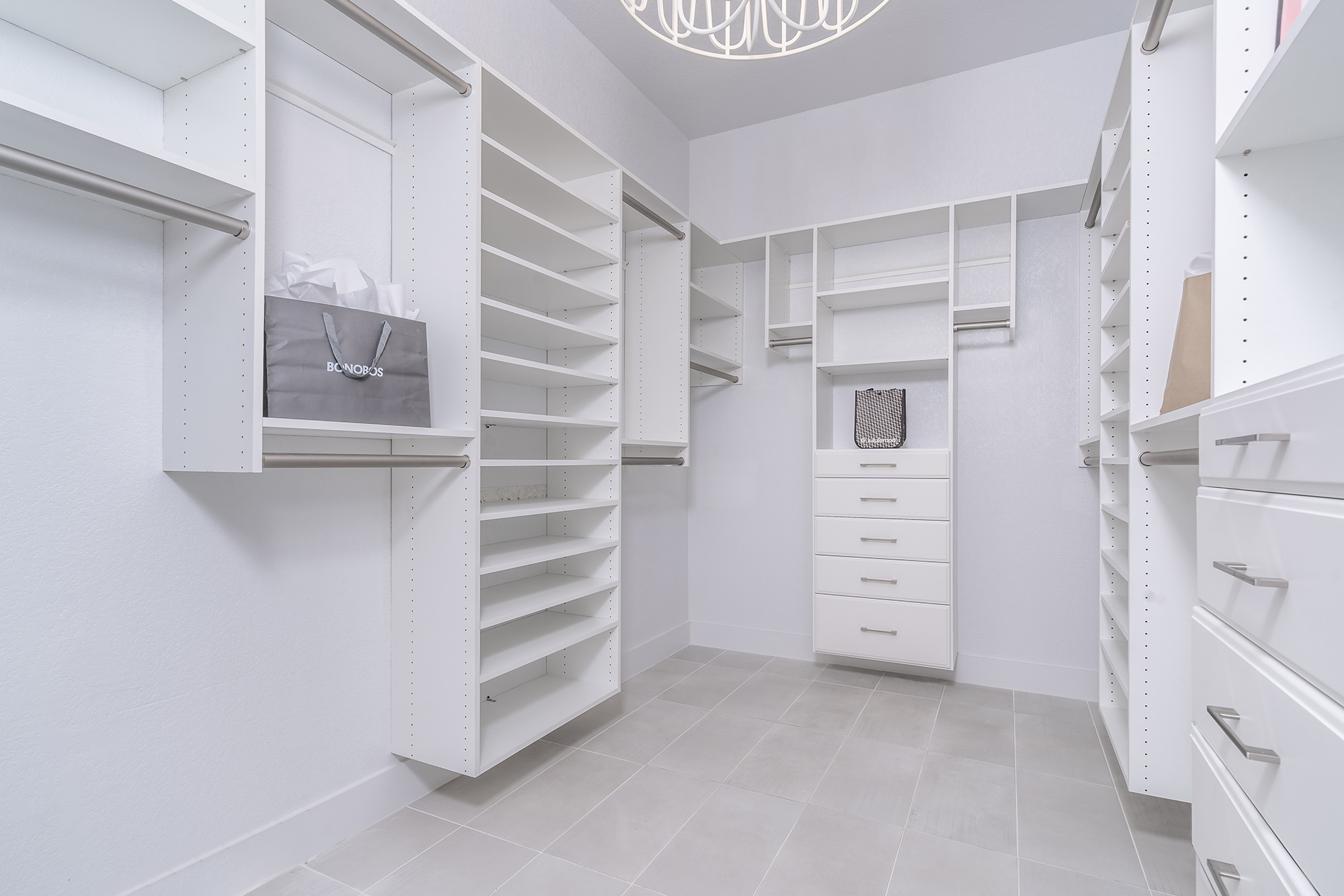 120 Diamondback Drive Georgetown, TX 78628 - Photo 28 of 39 a view of walk in closet with clothes and shoes