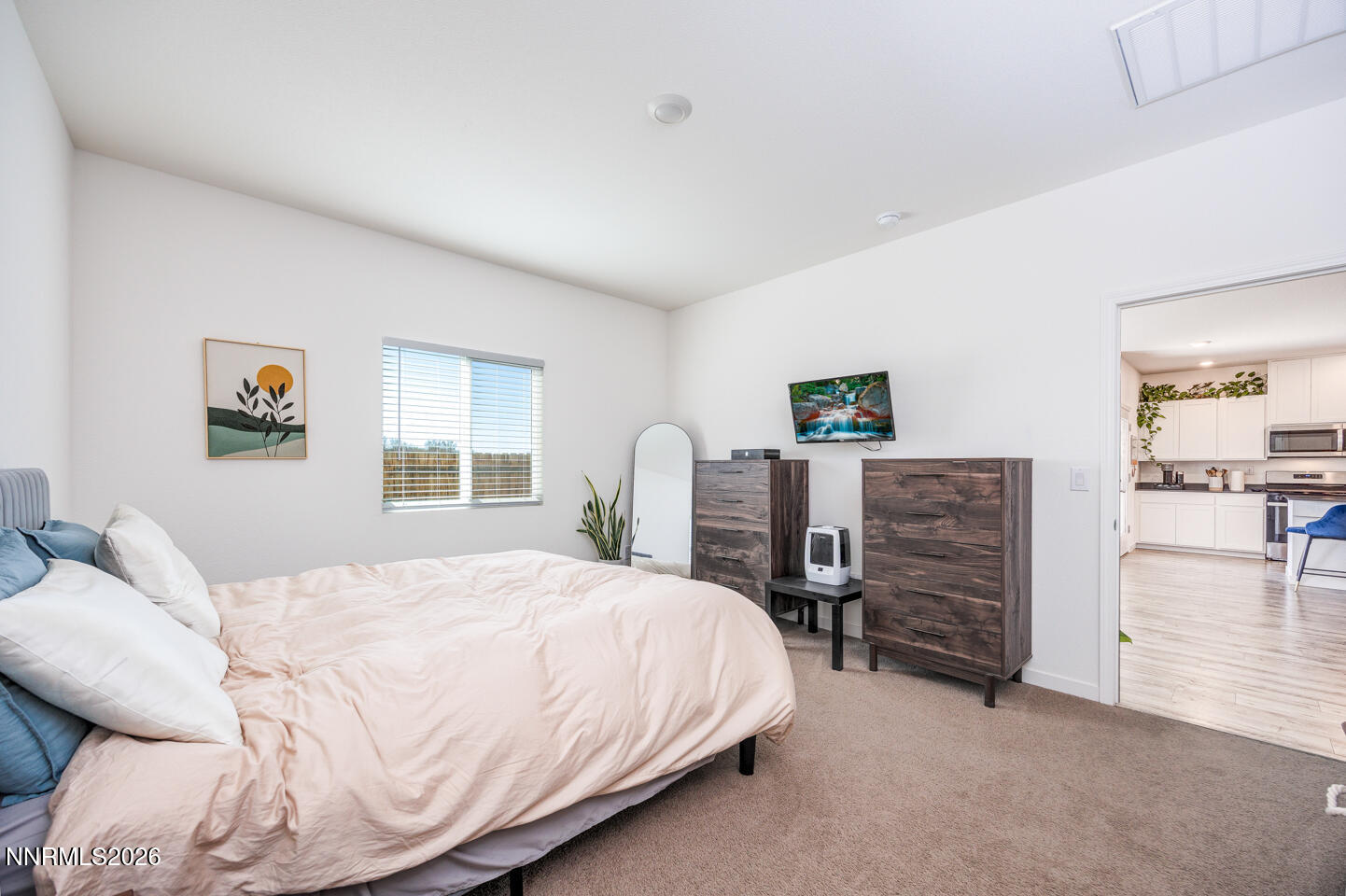 1049 Tamarack Court Fallon, NV 89406 - Photo 14 of 27 a bedroom with a bed and dresser