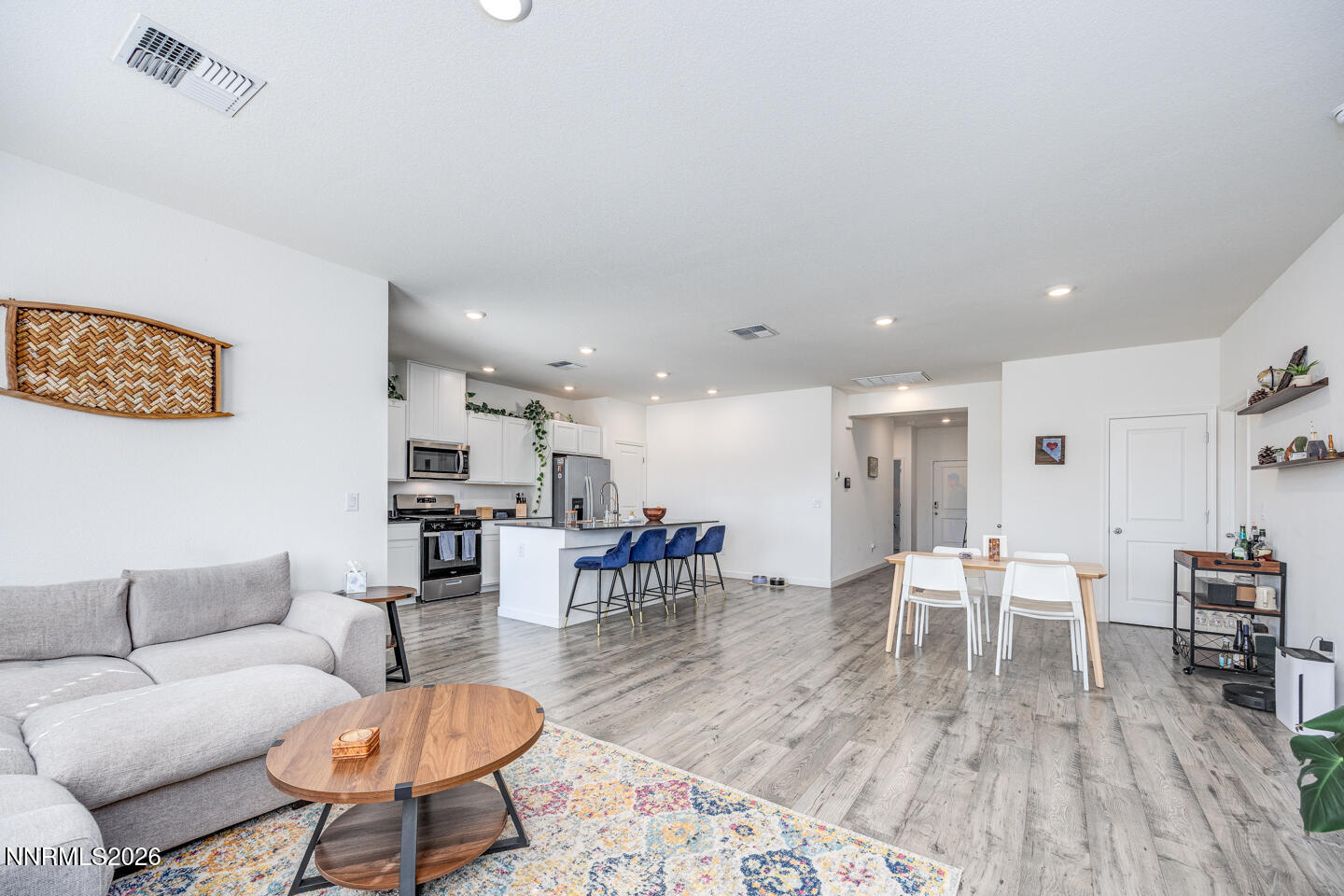 1049 Tamarack Court Fallon, NV 89406 - Photo 6 of 27 a living room with furniture wooden floor and kitchen view