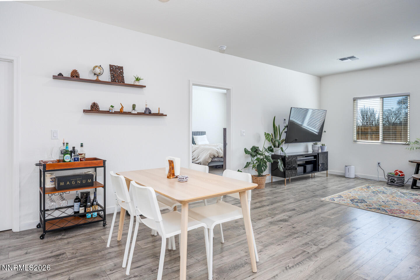 1049 Tamarack Court Fallon, NV 89406 - Photo 9 of 27 a view of a dining room with furniture and wooden floor
