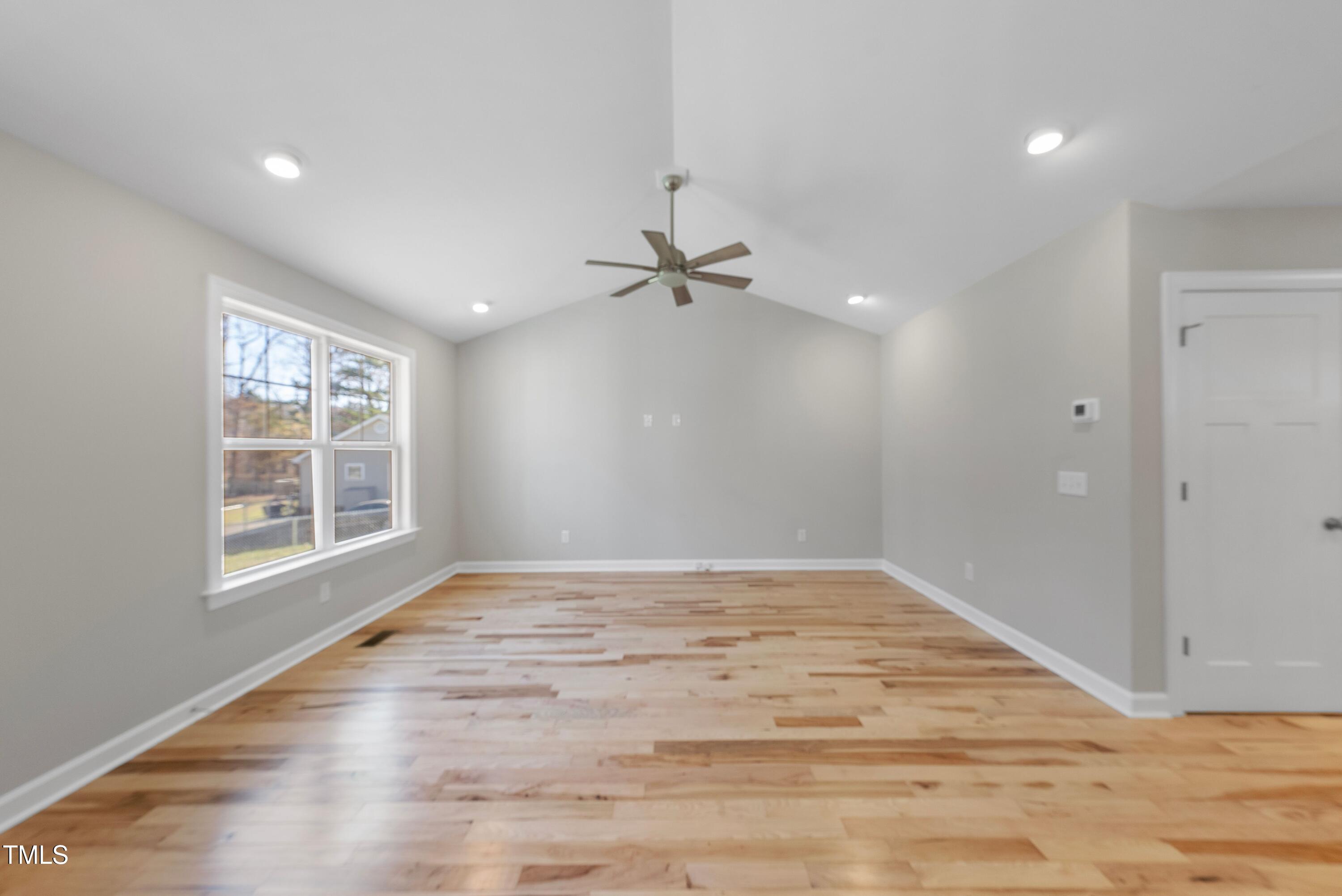 9425 Meredith Drive Rougemont, NC 27572 - Photo 11 of 29 a view of an empty room with wooden floor and a window
