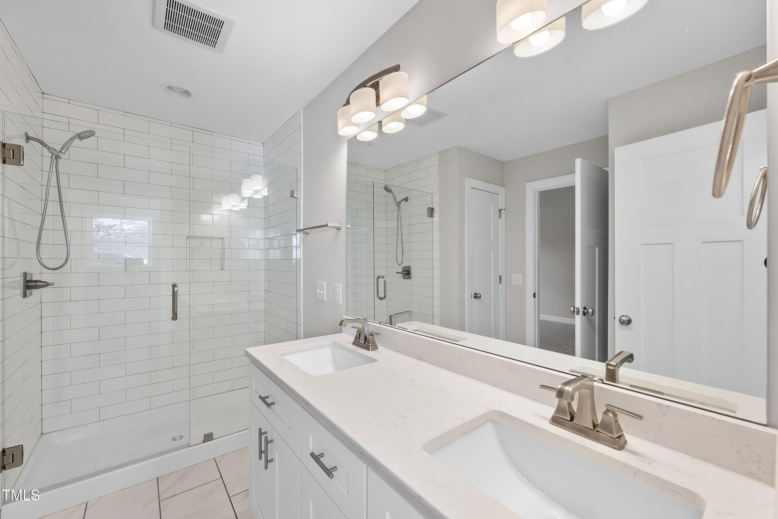 9425 Meredith Drive Rougemont, NC 27572 - Photo 14 of 29 a bathroom with a sink shower and a mirror