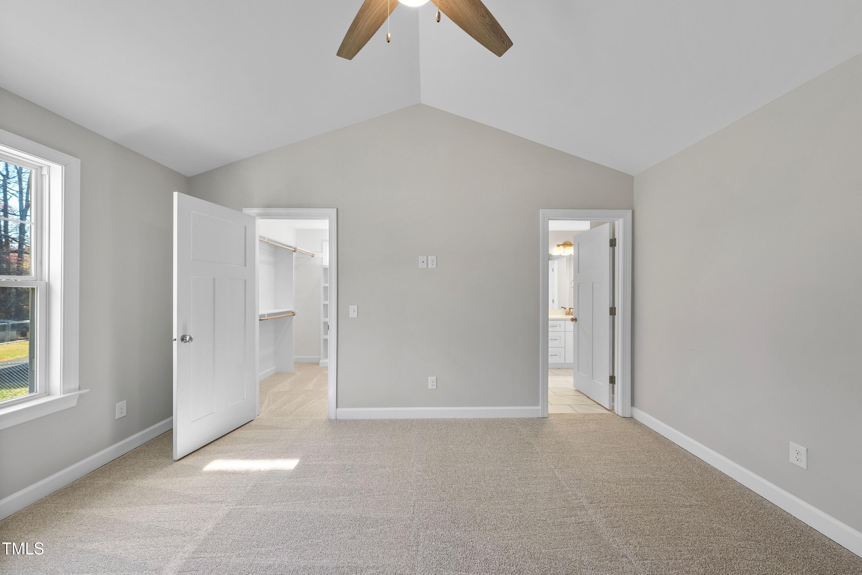 9425 Meredith Drive Rougemont, NC 27572 - Photo 16 of 29 an empty room with chandelier fan and window