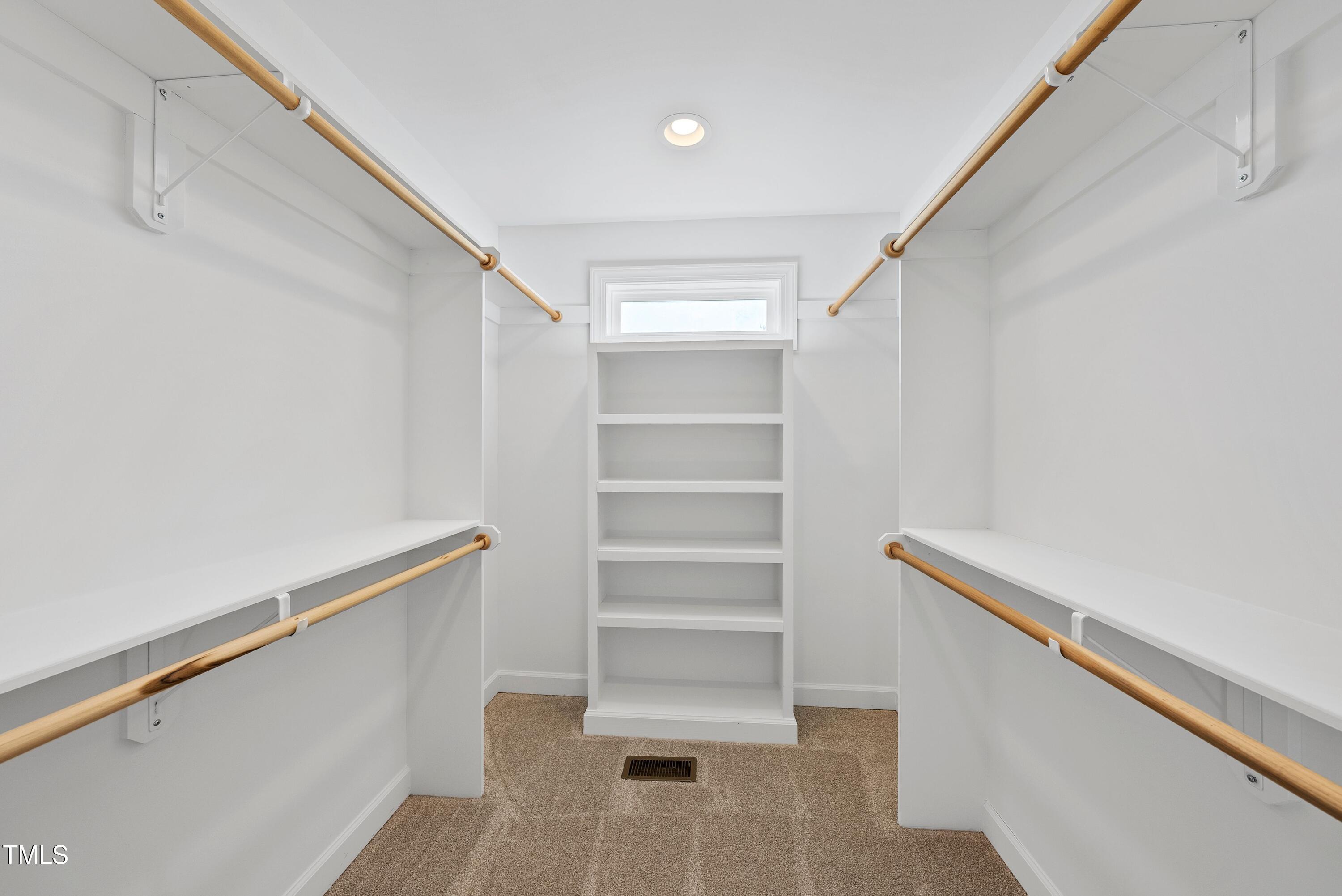 9425 Meredith Drive Rougemont, NC 27572 - Photo 17 of 29 a view of walk in closet with empty racks