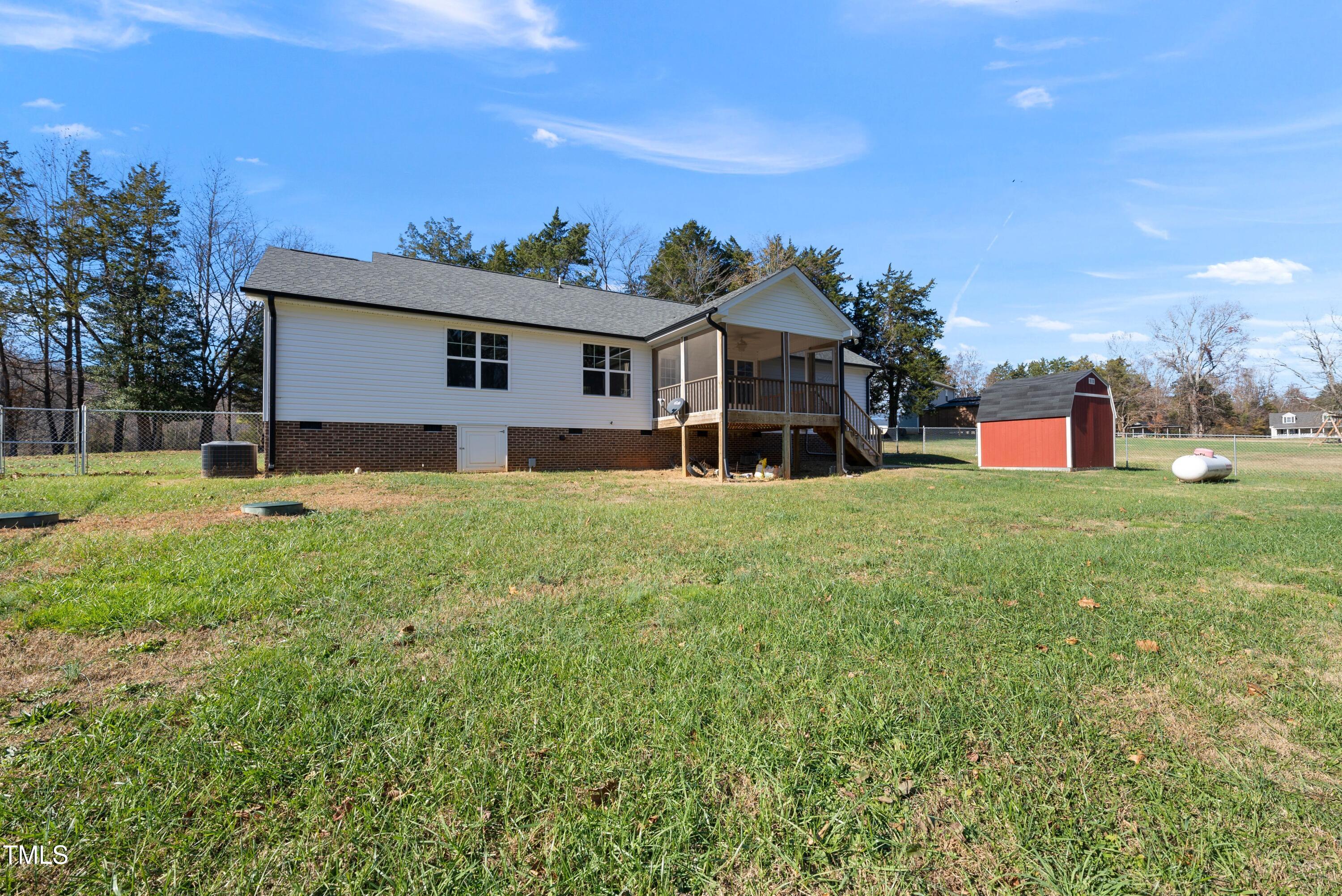 9425 Meredith Drive Rougemont, NC 27572 - Photo 28 of 29 a house view with a sitting space and garden