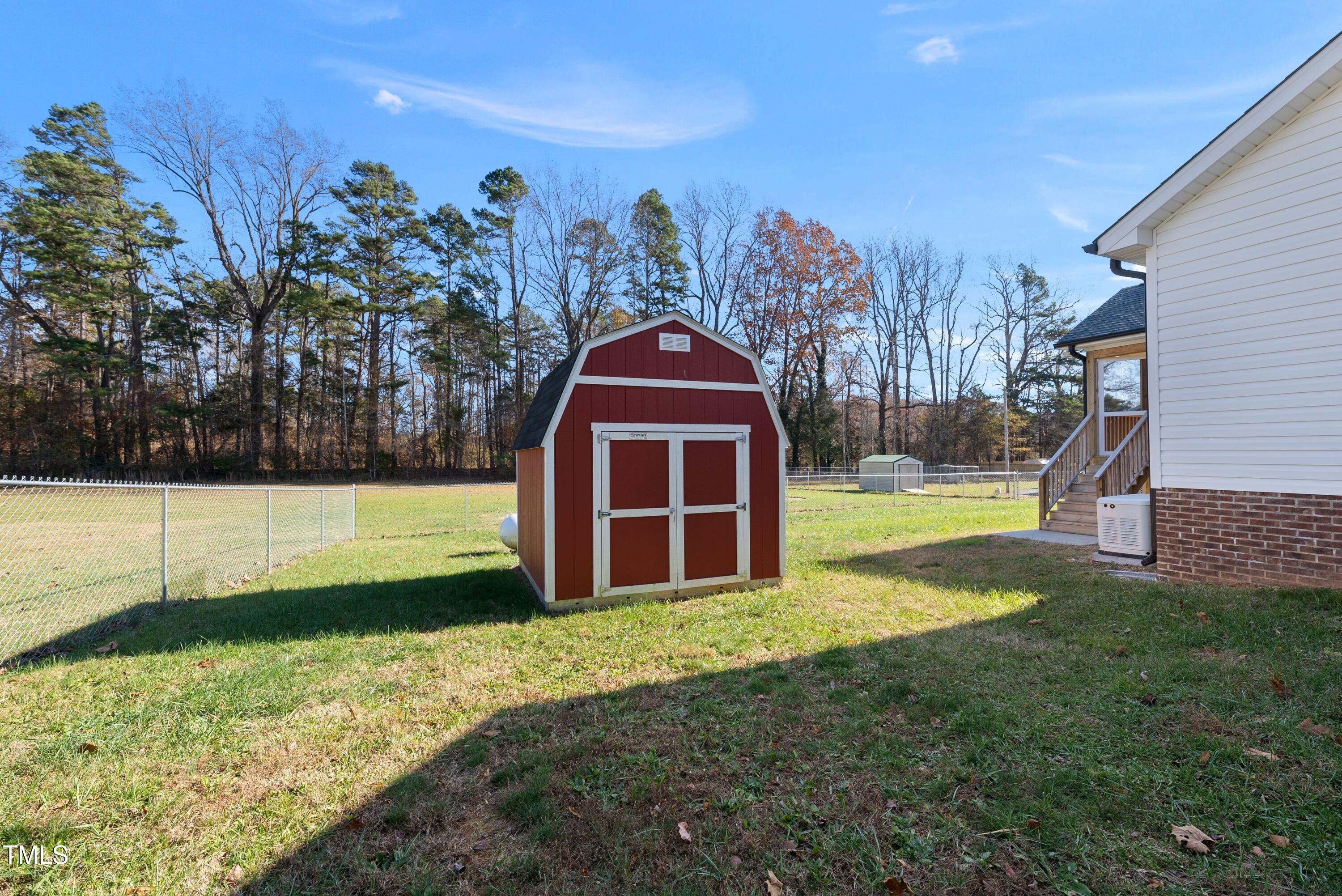 9425 Meredith Drive Rougemont, NC 27572 - Photo 29 of 29 a view of a yard with a house