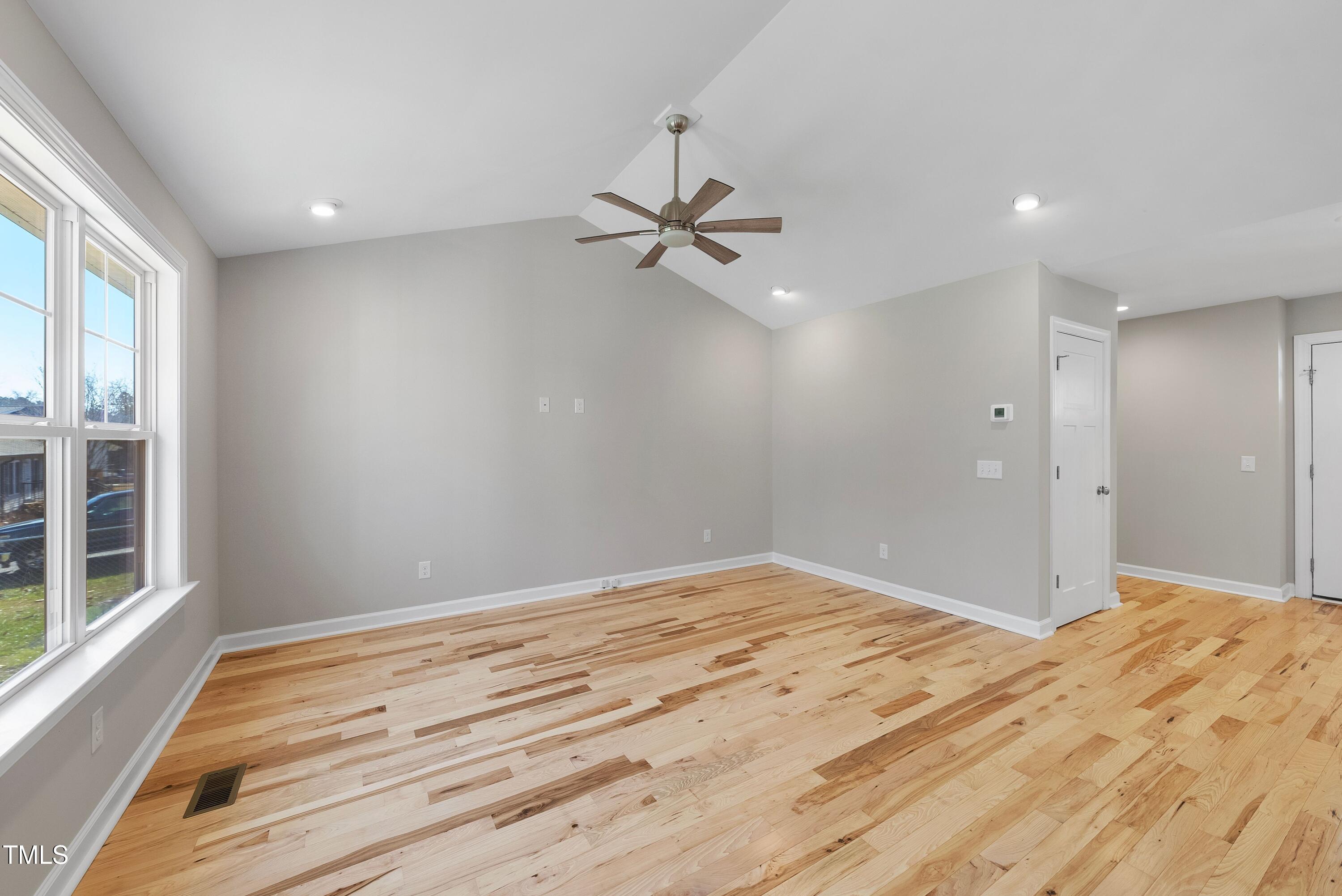 9425 Meredith Drive Rougemont, NC 27572 - Photo 9 of 29 a view of empty room with wooden floor and fan
