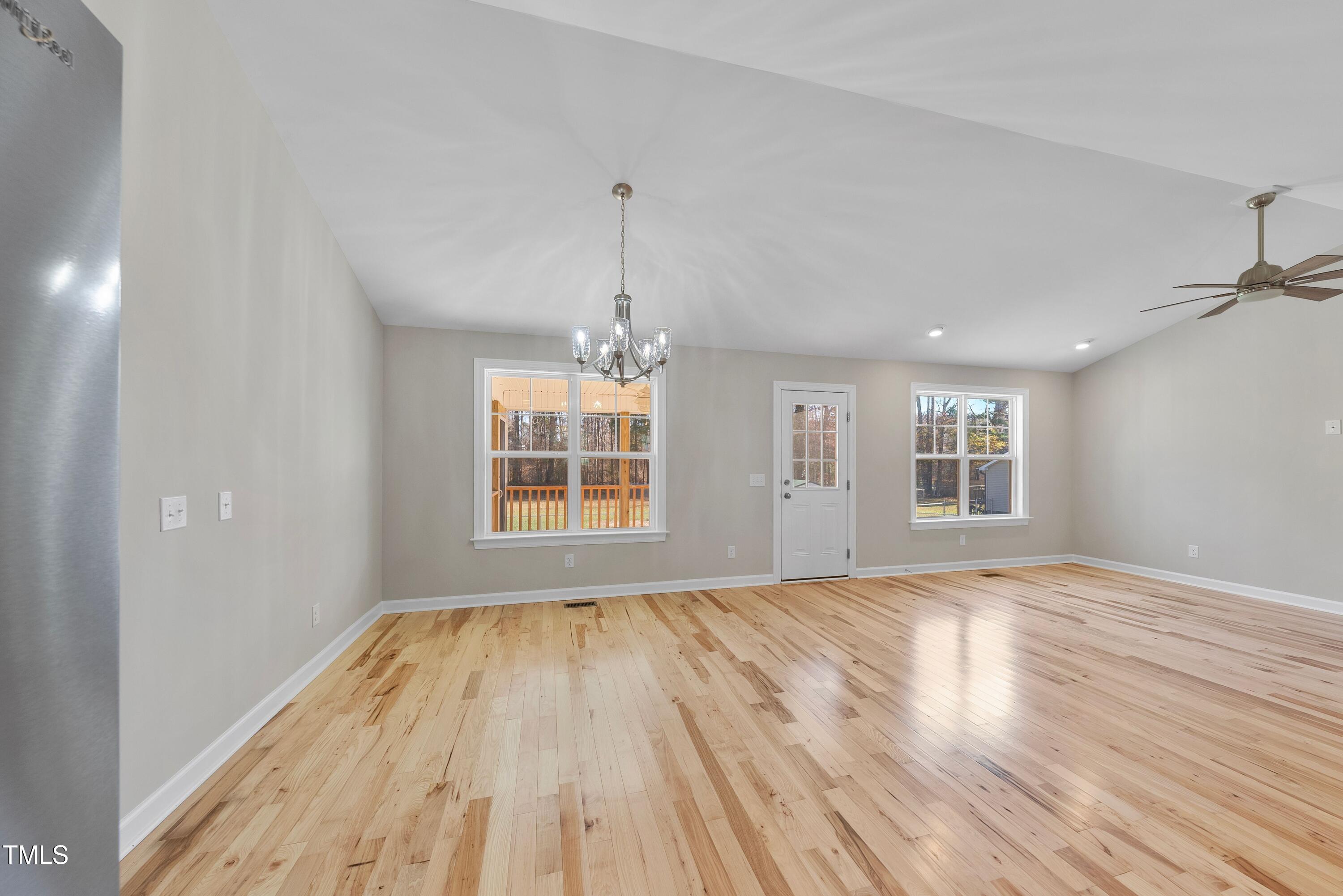9425 Meredith Drive Rougemont, NC 27572 - Photo 10 of 29 a view of empty room with wooden floor and fan