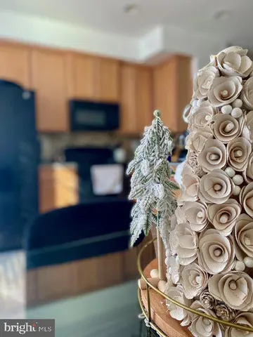 a kitchen with cabinets and chairs in it
