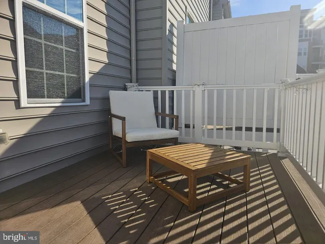 a view of a balcony with wooden floor