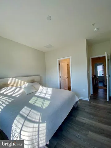 a bathroom with a sink toilet a mirror and shower