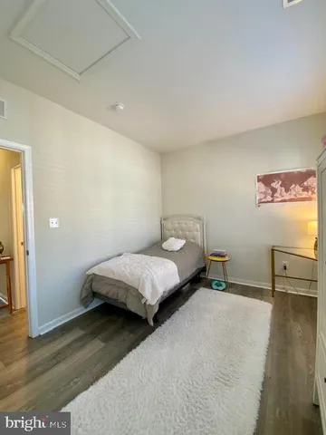 a bathroom with a sink a toilet and a shower curtain