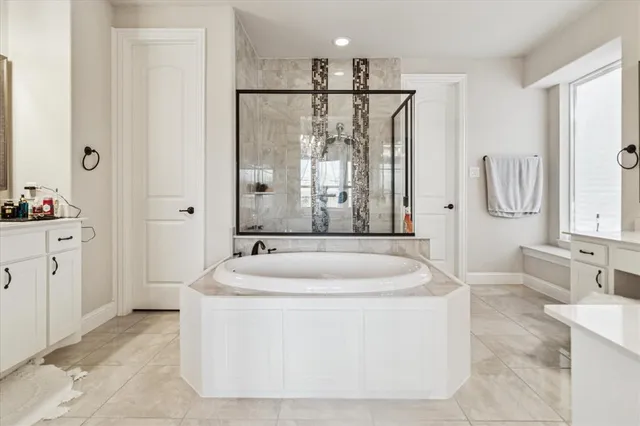 a spacious bathroom with sink and mirror