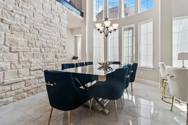 a view of a dining room with furniture and windows
