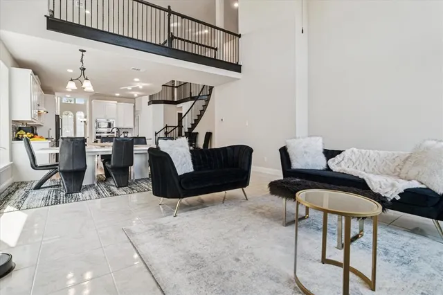 a view of a livingroom with furniture and a chandelier