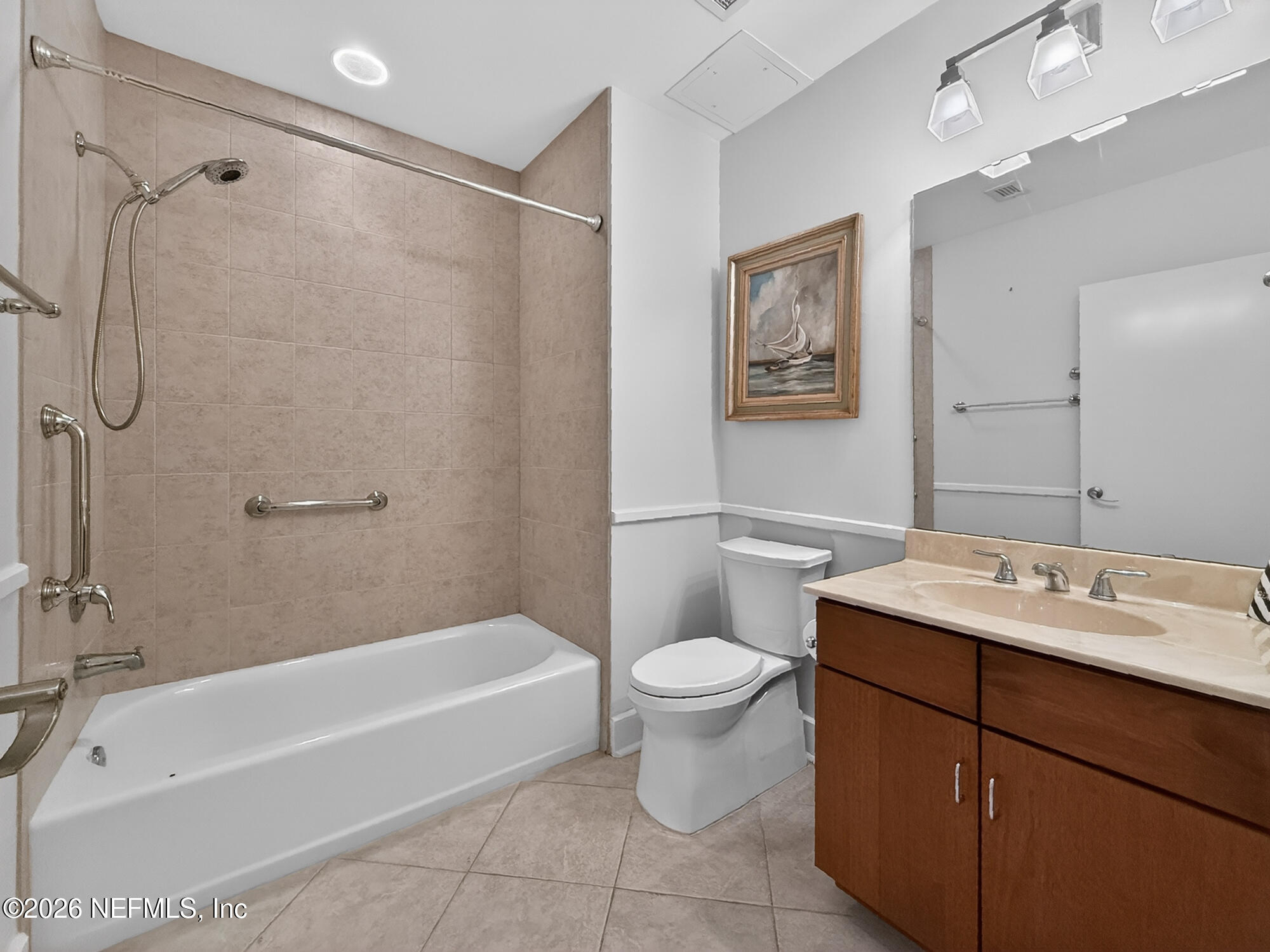 1661 Riverside Avenue, Unit 407 Jacksonville, FL 32204 - Photo 18 of 60 a bathroom with a sink toilet and shower