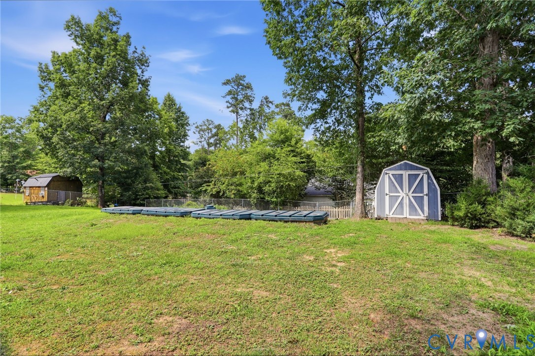 14420 Branding Iron Road Chesterfield, VA 23838 - Photo 37 of 50 Expansive backyard featuring a manicured lawn, a b
