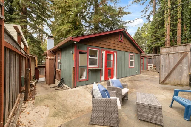 a backyard of a house with yard and seating space