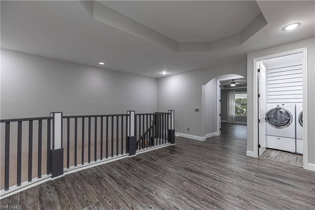 1330 Mariposa Circle, Unit 103 Naples, FL 34105 - Photo 15 of 32 a view of hallway with wooden floor