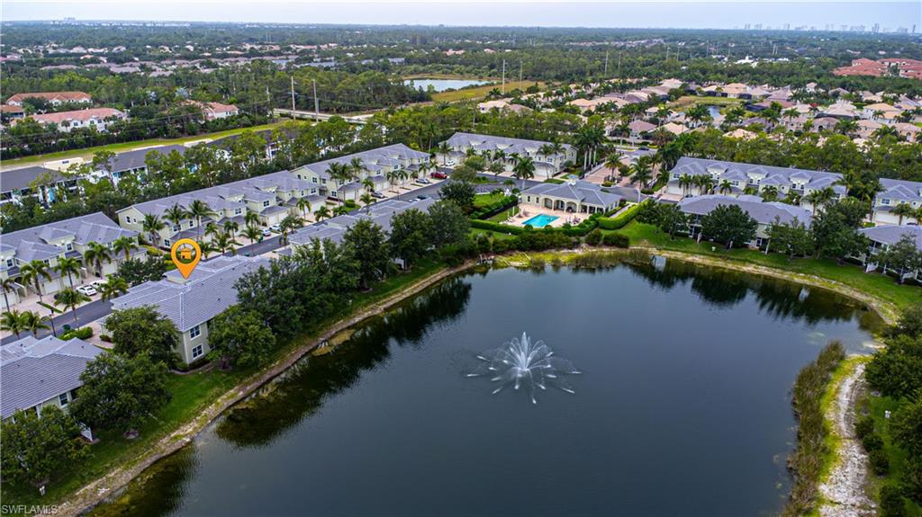 1330 Mariposa Circle, Unit 103 Naples, FL 34105 - Photo 2 of 32 an aerial view of a city with lake view