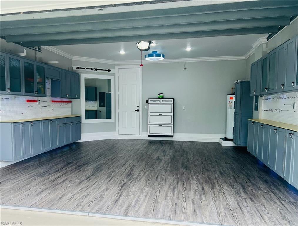 1330 Mariposa Circle, Unit 103 Naples, FL 34105 - Photo 31 of 32 a view of an empty room with wooden floor