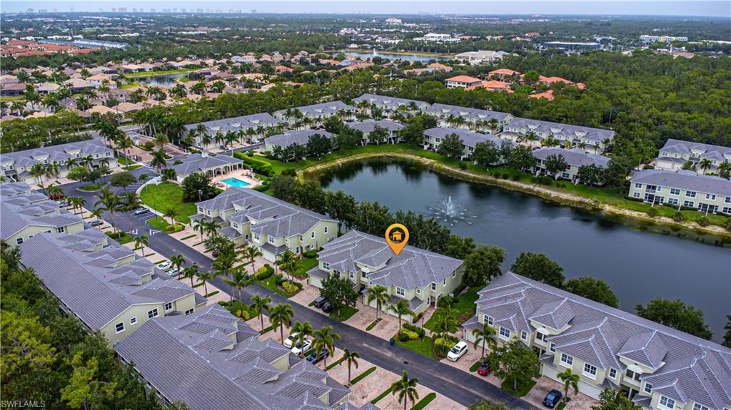 1330 Mariposa Circle, Unit 103 Naples, FL 34105 - Photo 32 of 32 an aerial view of lake and residential houses with outdoor space