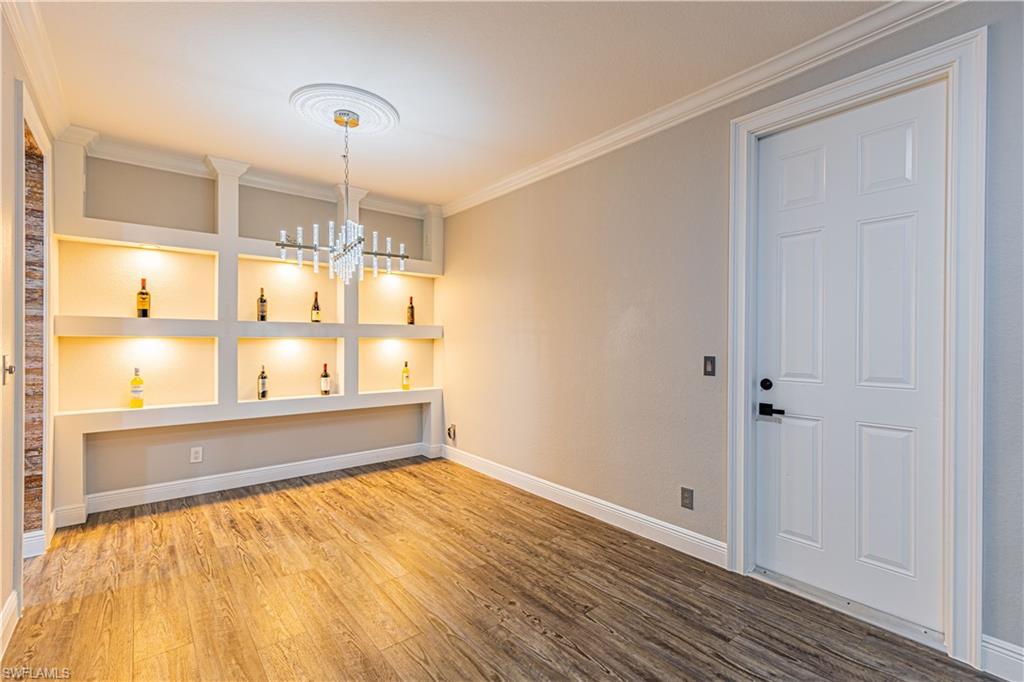 1330 Mariposa Circle, Unit 103 Naples, FL 34105 - Photo 5 of 32 a bathroom with a bathtub and shower